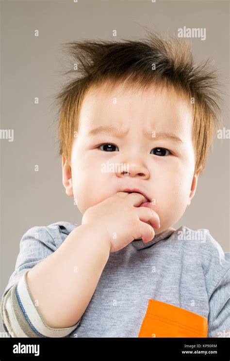 Baby Boy Finger In Mouth Stock Photo Alamy