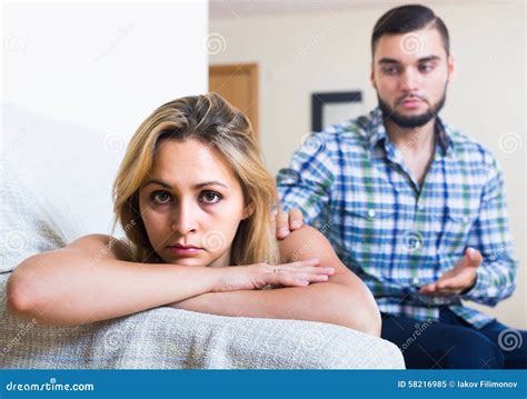Adult Asking Offended Partner For Forgiveness At Home Stock Image