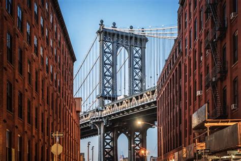 Dumbo The Famous Manhattan Bridge Between Two Red Brick Buildings In