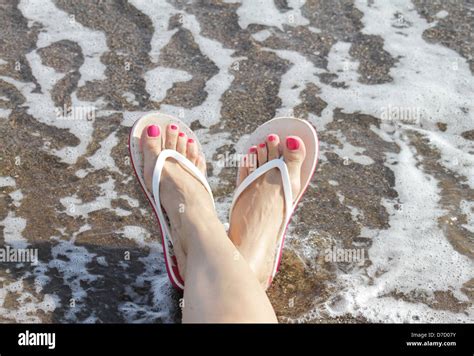 Woman Feet With Flip Flops On The Beach Stock Photo Alamy
