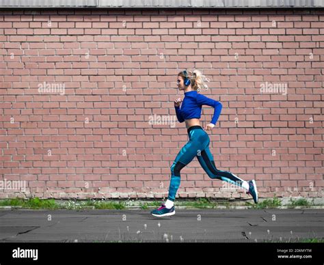 Woman Jogging Outdoor In A Sunny Day Sport And Healthy Lifestyle