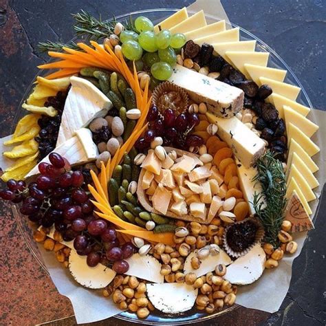 Beautiful Presentation And Selection Of Cheeses Fruits And Nuts