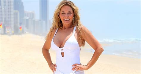 Carol Vorderman Shows Off Her Incredible Curves In Plunging White