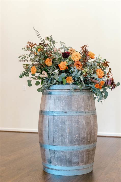 Fall Themed Barrel Arrangement In 2021 Ceremony Flowers Event Floral