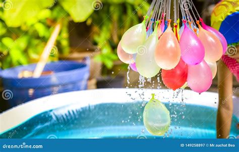 Colorful Water Balloons Play In Plastic Swimming Pool Stock Image