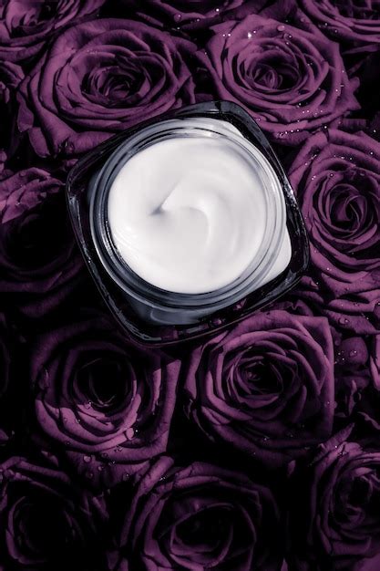 Premium Photo Face Cream Skin Moisturizer On Purple Roses Flowers