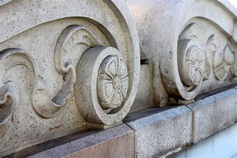 Intricate Detail In Carvings On Old Stone Columns Of Building Stock