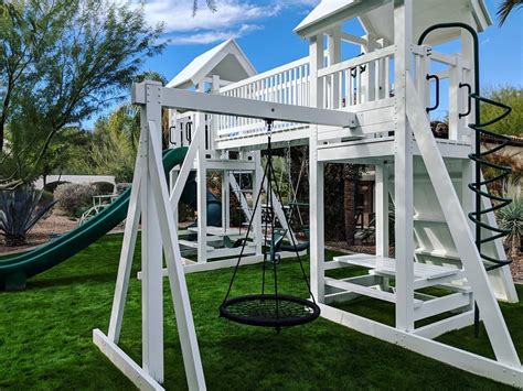 I was worried that the griege we picked out to match the house was looking too white, until we added the bright white trim pieces back on and then it looked perfect! Ruffhouse Vinyl Swing Sets - Backyard Playgrounds and ...