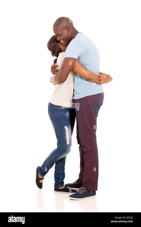 Full Length Portrait Of Loving African American Couple Hugging Stock