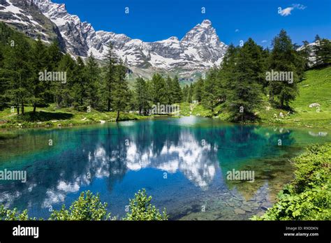 Summer Alpine Landscape With The Matterhorn Cervino Reflected On The