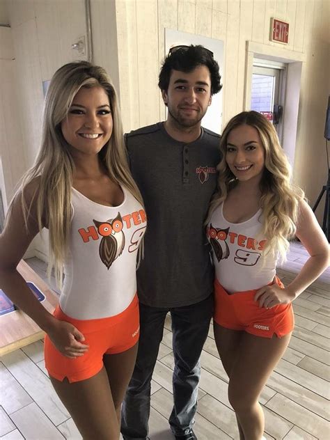 Two Hooter Girls And One Guy Standing In The Middle Hooters Girl Costume Hooters Girls