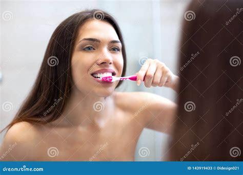 Girl Standing In Front Of The Mirror And Brushing Teeth Stock Image Image Of Healthy Luxury