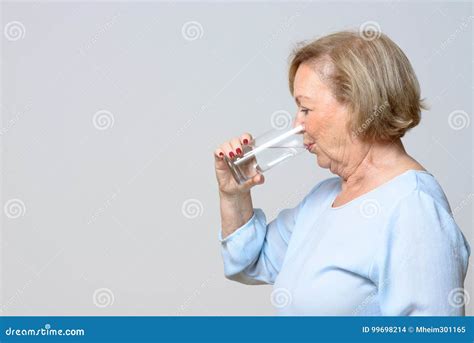 Senior Woman Drinking A Glass Of Fresh Water Stock Photo Image Of