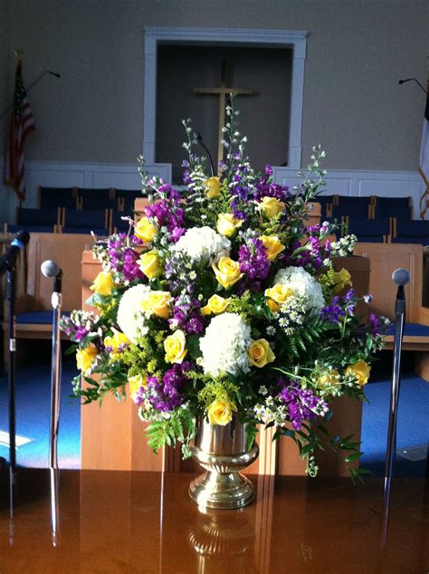 beautiful flowers for the church with softer shades of purple in place of yell… easter flower