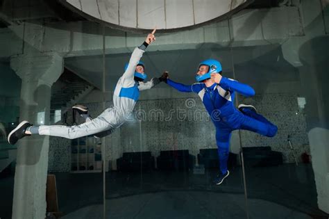 A Man And A Woman Enjoy Flying Together In A Wind Tunnel Free Fall