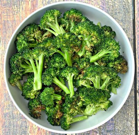Upon pulling the basket, you will spread butter over the broccoli florets and sprinkle with chicken seasoning. Easy Air Fryer Roasted Broccoli + {Cooking VIDEO}