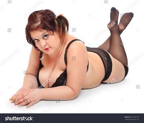 Overweight Woman Dressed In Retro Lingerie On A White Background Stock