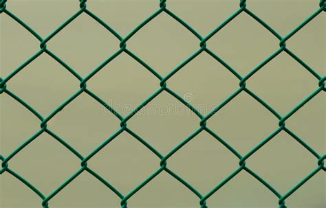 Green Wire Fence Isolated On Brown Background Horizontal Stock Image