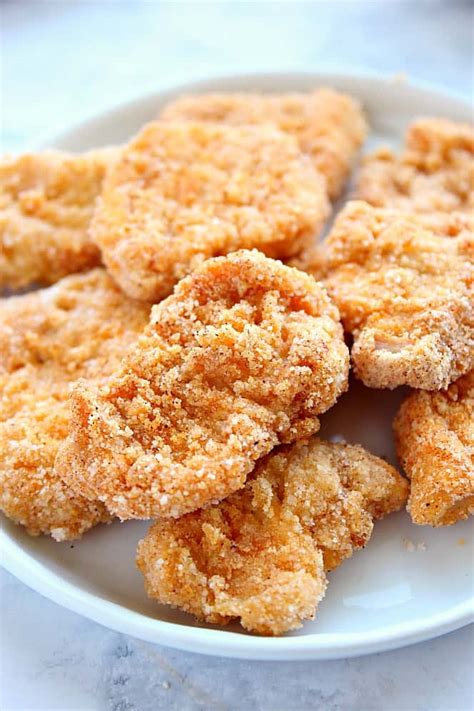 These baked chicken nuggets are simple, yet yield a flavorful, moist baked version of chicken nuggets that grown ups can love just as much as kids. Gluten Free Baked Chicken Nuggets Recipe - Crunchy Creamy ...