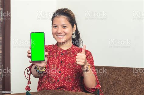 Young Indian Girl Showing Her Mobile Phone With Green Screen Indian