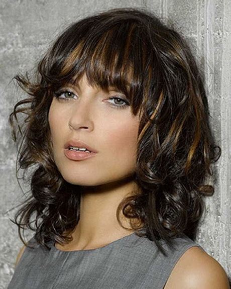 Cute long layered hairdo for curly hair. Medium length layered curly hairstyles