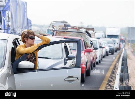 Frustrated Middle Aged Hispanic Woman Stuck In A Traffic Jam Stock