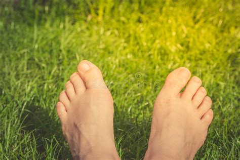 Close Up Of Woman Feet On The Green Grass Stock Photo Image Of