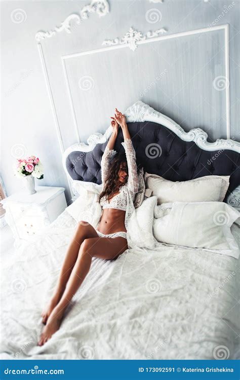 Woman Posing On Bed In White Lingerie Stock Image Image Of Pretty
