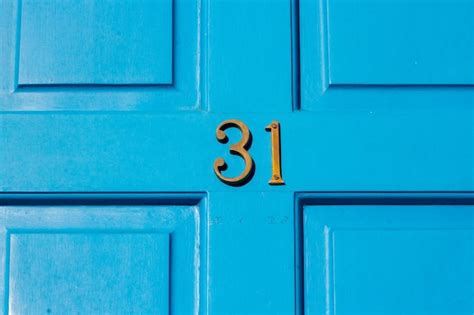Premium Photo House Number 31 On A Blue Wooden Front Door In London