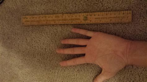 Female Measuring And Comparing Hands