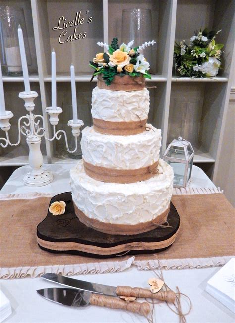Rustic Wedding Cake With Burlap And Twine On Handmade Wood Grain
