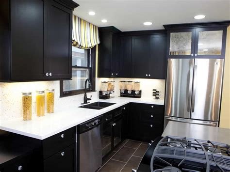 Mirror and red soap dispenser: 25 Black Kitchen Cabinets That Are Not Dull
