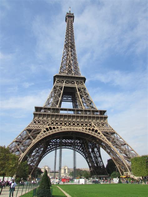 The eiffel tower is an iron tower built on the champ de mars beside the river seine in paris. Free Images : architecture, city, eiffel tower, paris, monument, travel, france, europe, arch ...
