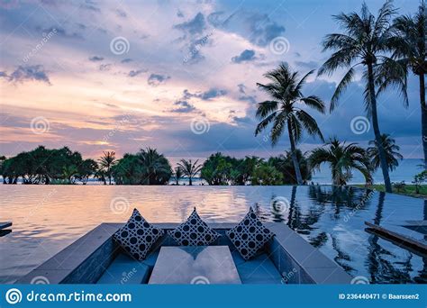 Watching Sunset In Infinity Pool On A Luxury Vacation In Thailand Watching Sunset On The Edge