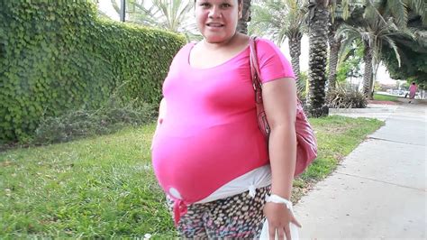 pregnant woman walking up the sidewalk youtube