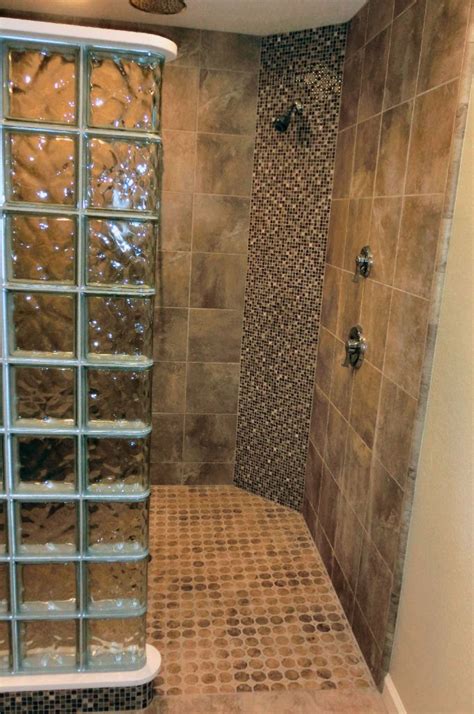 Glass panel installed with schluter deco sg around a curbless, doorless shower. Custom Curbless And Doorless Curved Glass Block Shower Project
