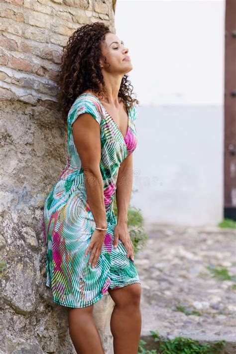 Beautiful Brunette Middle Aged Woman Wearing Dress Outdoors Stock Photo