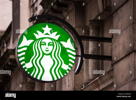 The Starbucks Sign Outside A Coffee Shop In The City Of London Stock