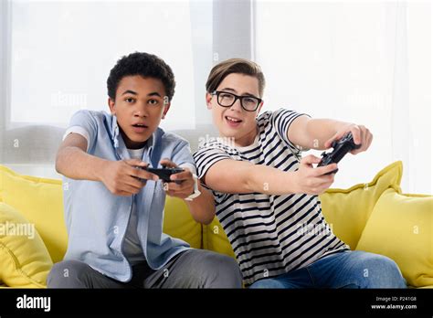 Multicultural Teen Boys Playing Video Game At Home Stock Photo Alamy