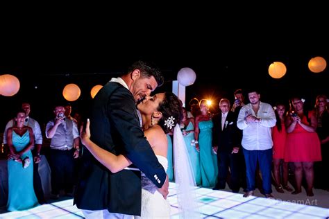 Bride And Groom Share A Kiss During Their Wedding Reception In The