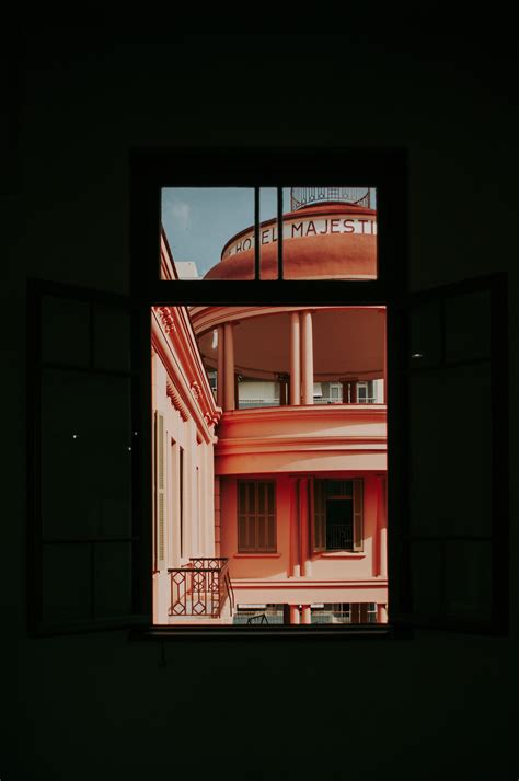 An Orange Painted Building Through A Window Pixeor Large Collection