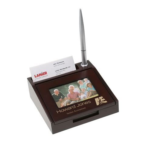 A desk business card holder is simple way to display your company or personal details in an interactive way to encourage customers and visitors to take one. Personalized Wooden Desk Business Card Holder with Pen and Picture Frame