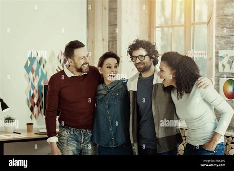 Positive Trade Marketing Team Having A Good Time Together Stock Photo