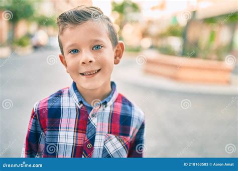 Adorable Caucasian Boy Smiling Happy Standing At The City Stock Image