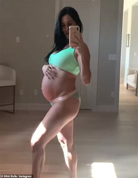 Nikki Bella Flaunts Her Growing Baby Bump In A Green Bra And Panties As