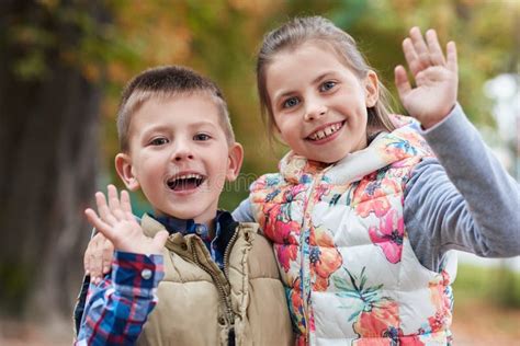 Cute Little Kids Waving Hello In The Park Stock Photo Image Of Park