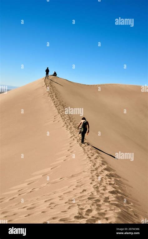 People Hiking In The Tallest Sand Dunes In North America Great Sand
