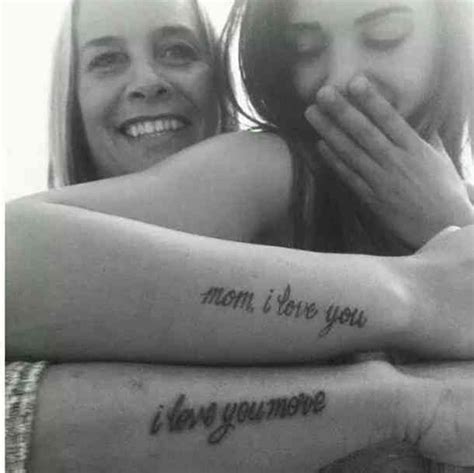 two women with tattoos on their arms and the words mom i love you are in cursive writing