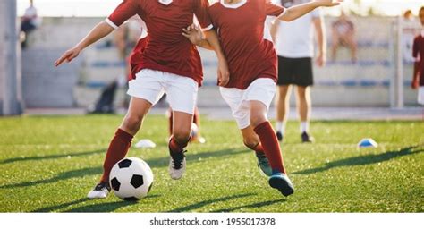 Two Young Football Players Running Ball Stock Photo 1955017378