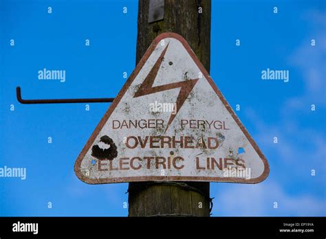 Danger Overhead Electric Lines Sign Stock Photo Alamy